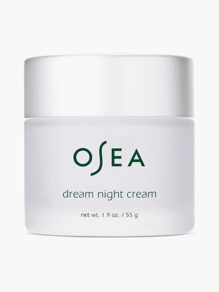 Collagen Dream Night Cream in branded clear jar with silver cap on light gray backgrounnd